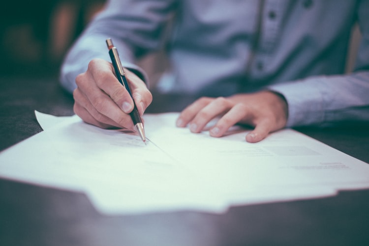 Person filling out application form