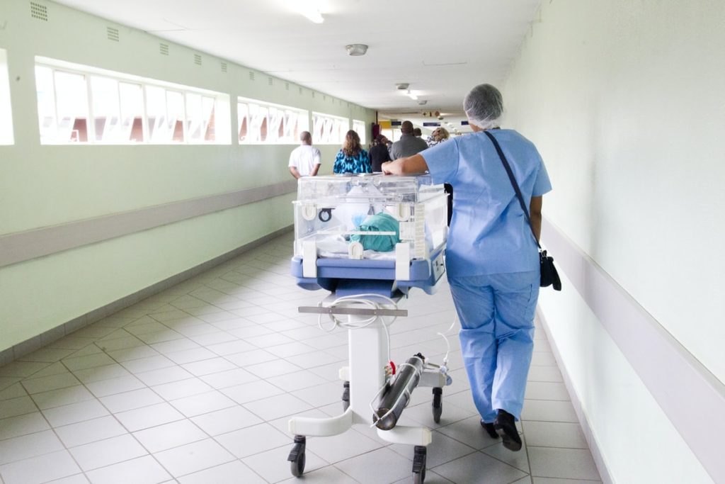 medical student walking down hospital corridor