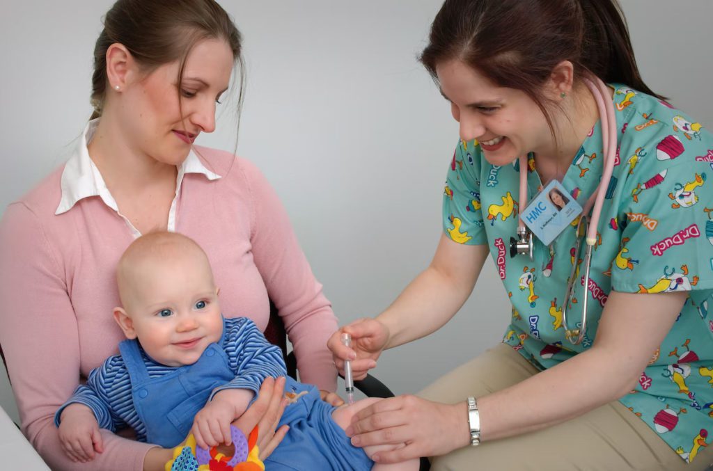 pediatrician administering injection