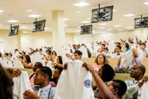 grads participating in white coat ceremony