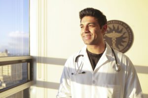aua graduate in white coat
