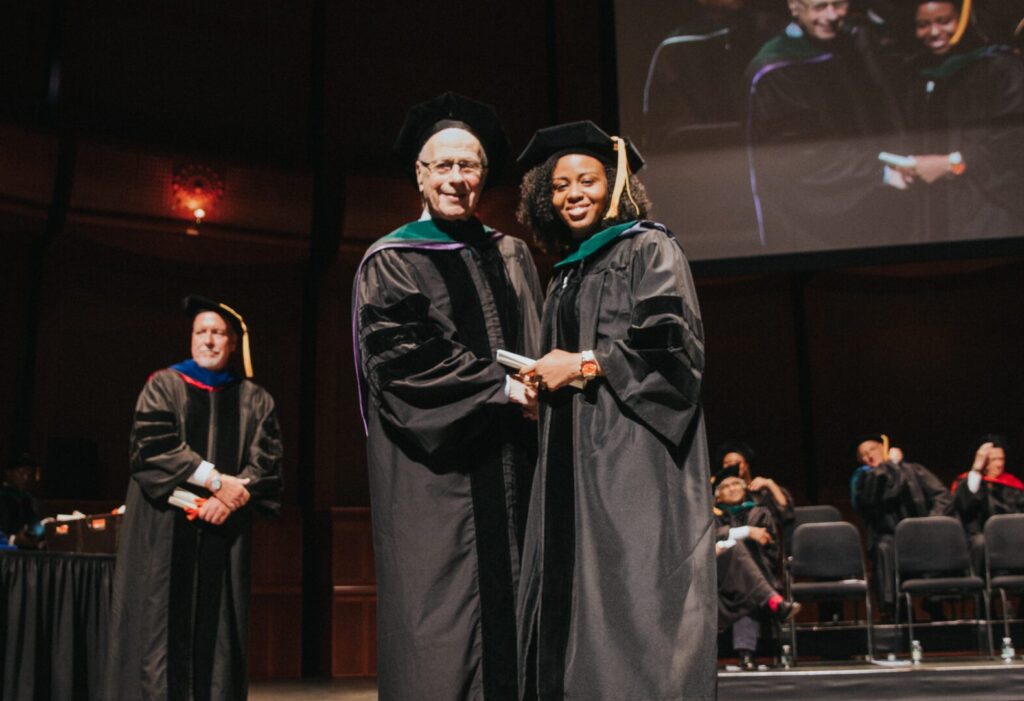 aua graduate receiving diploma